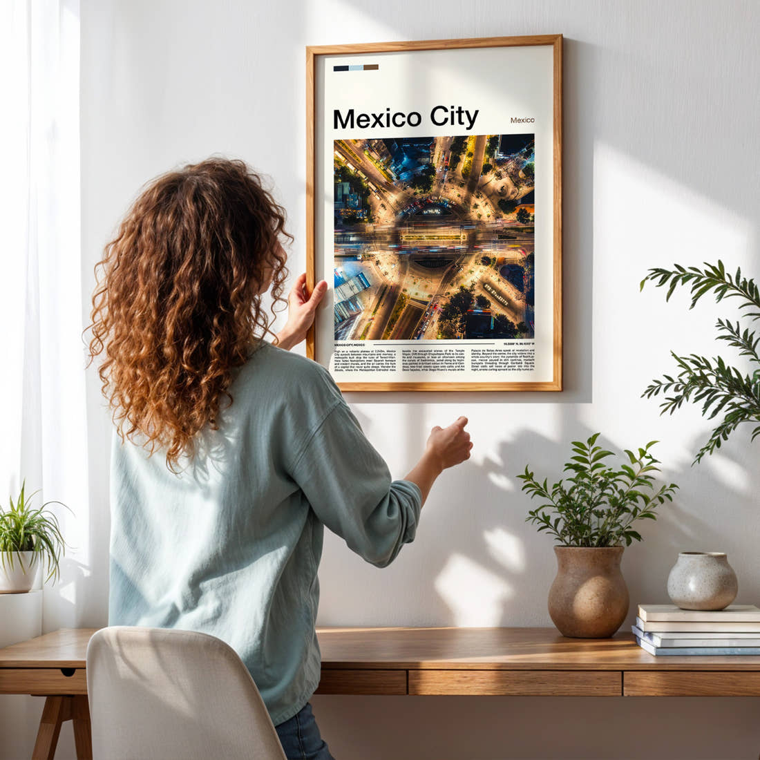 Mexico City Aerial Traffic Roundabout Travel Print framed on a pale wall beside houseplants