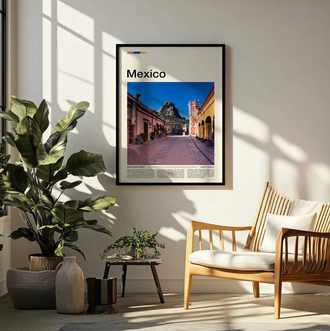 Mexico Pink Cobbled Street Travel Print framed on a pale wall beside houseplants