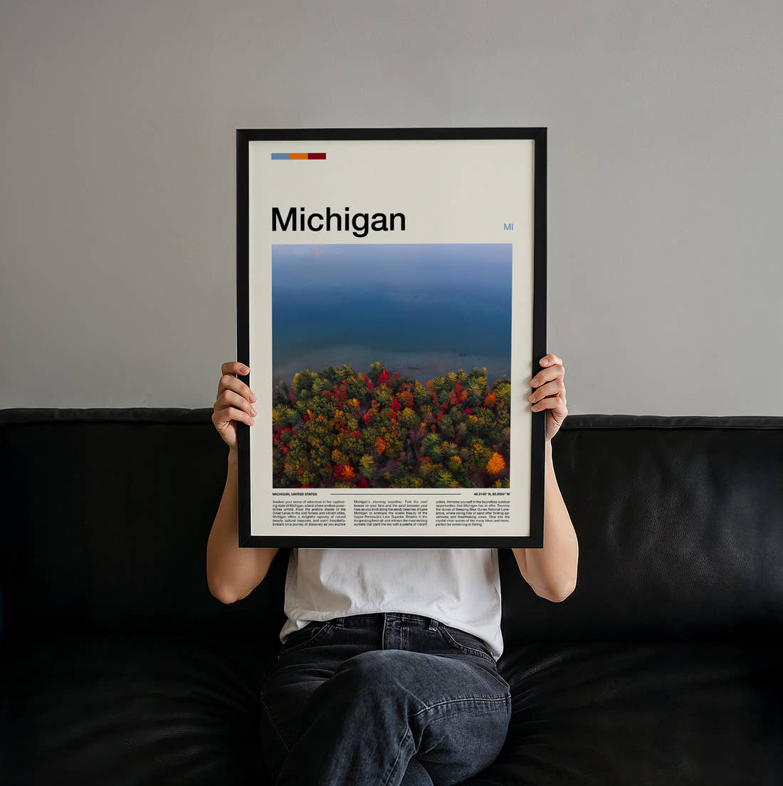 Michigan Autumn Trees By Water Travel Print held up by hand to show the size of the print