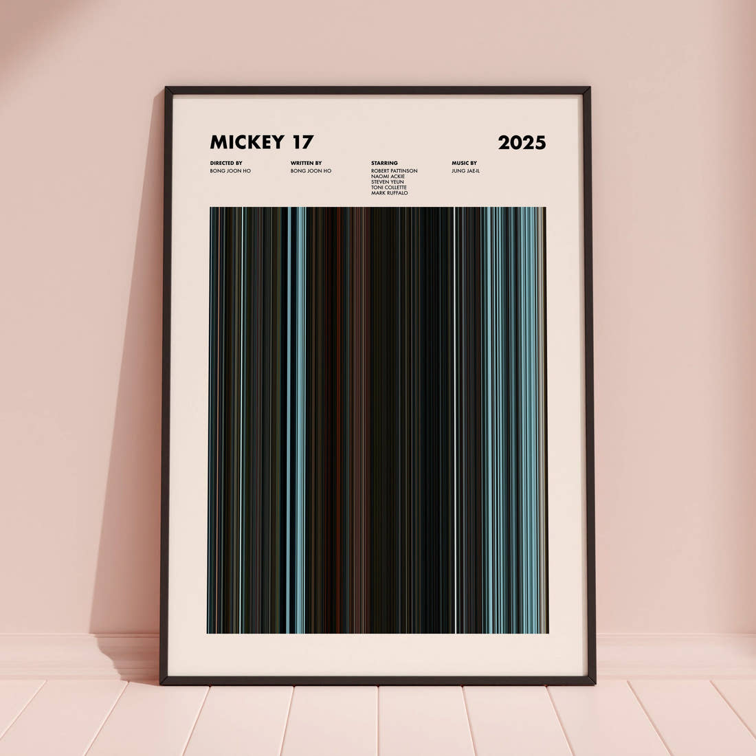 Mickey 17 Movie Barcode Poster framed and leaning against a coloured wall