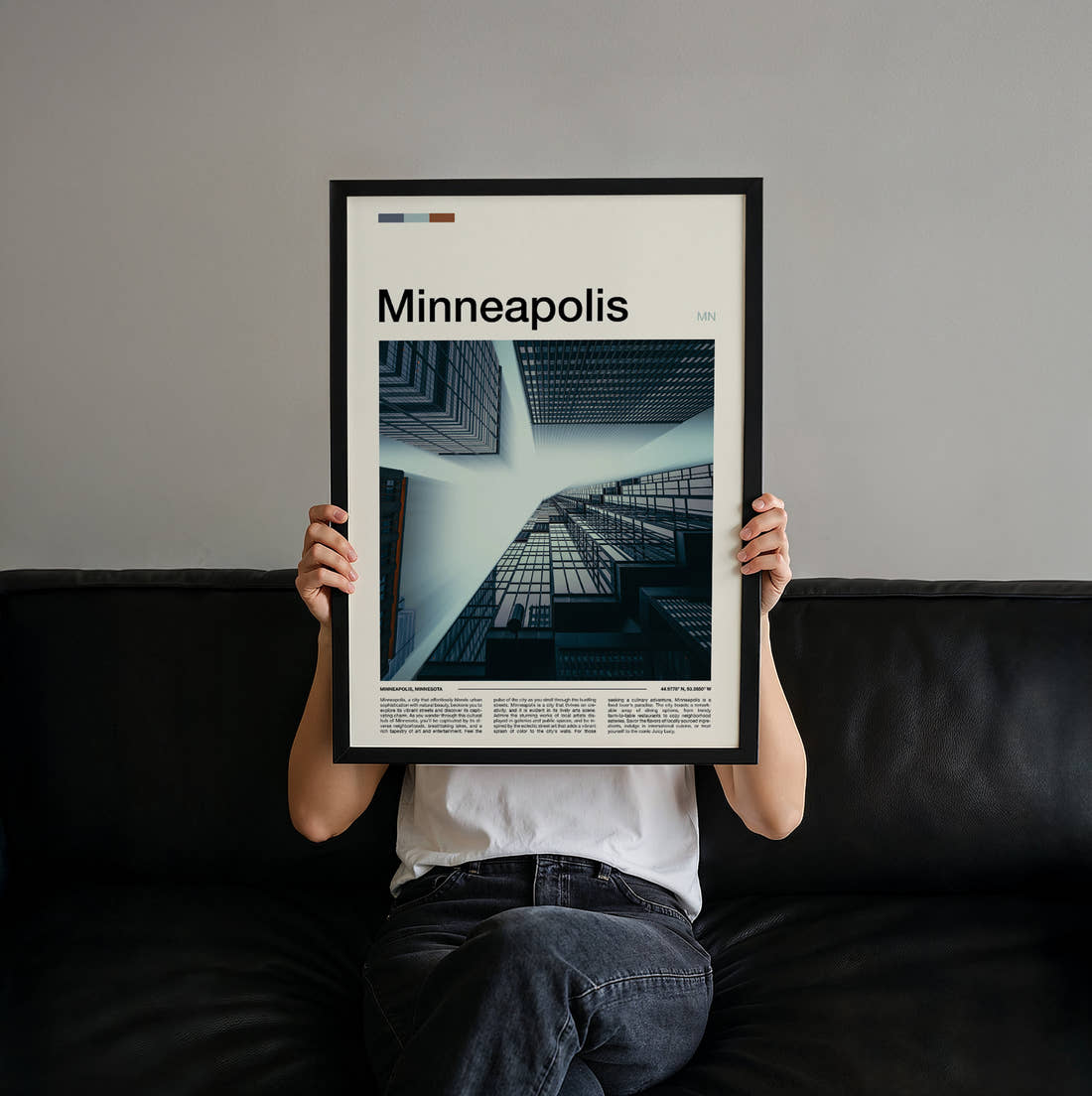 Minneapolis Glass Towers From Below Travel Print held up by hand to show the size of the print