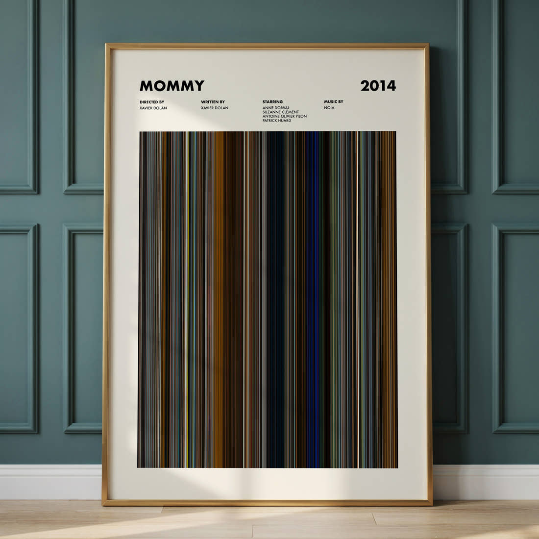 Mommy Movie Barcode Poster framed and leaning against a panelled wall