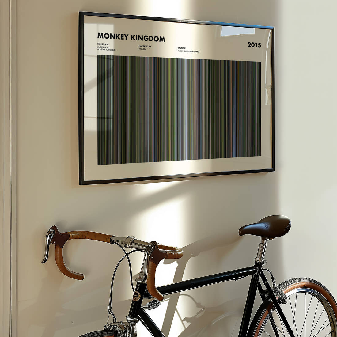 Monkey Kingdom Movie Barcode Poster framed on the wall of a styled room setting