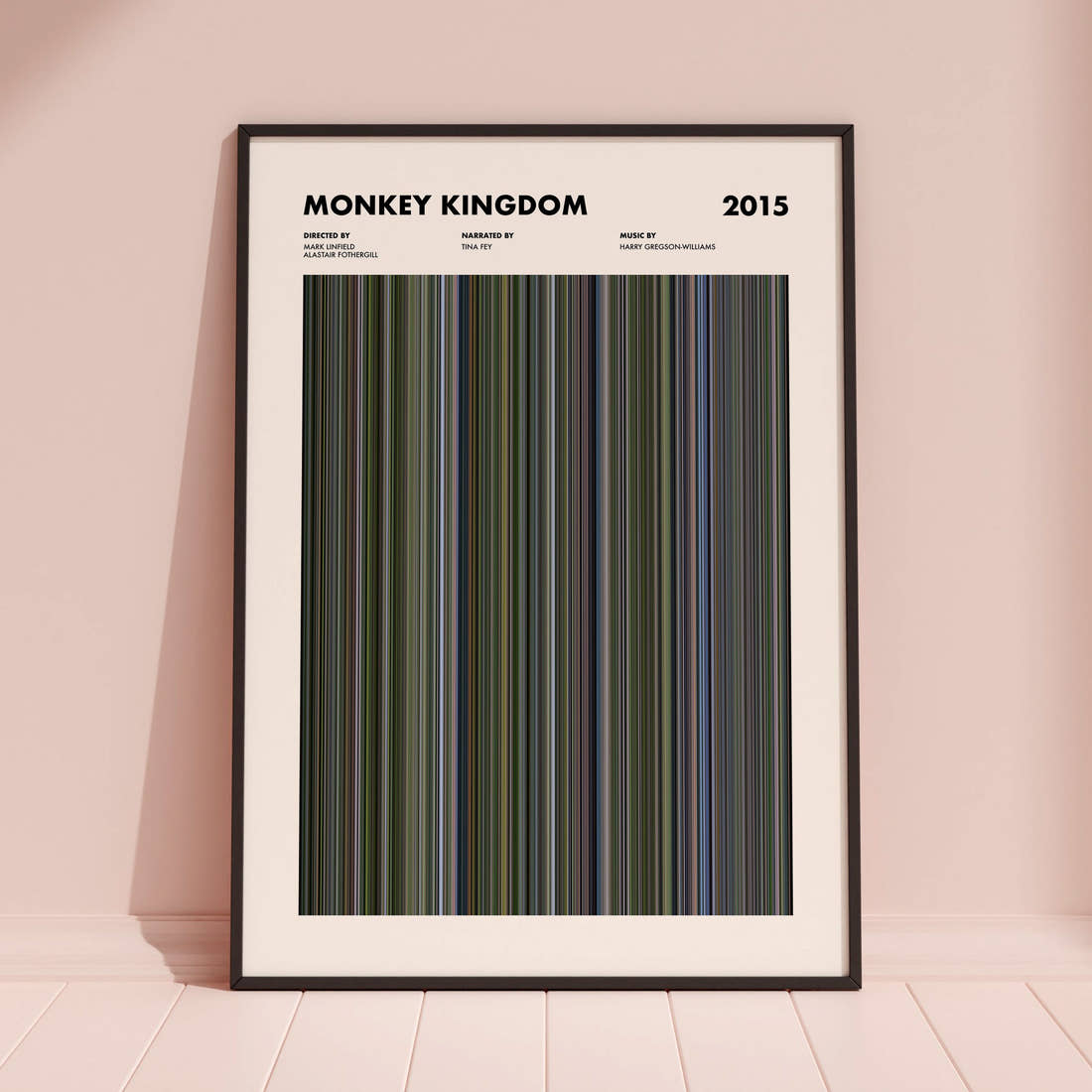 Monkey Kingdom Movie Barcode Poster framed and leaning against a coloured wall