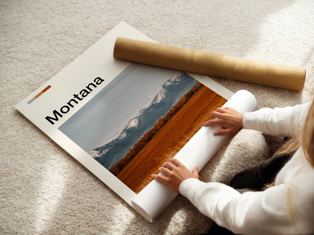 Montana Golden Field And Mountains Travel Print being unrolled from its postal tube