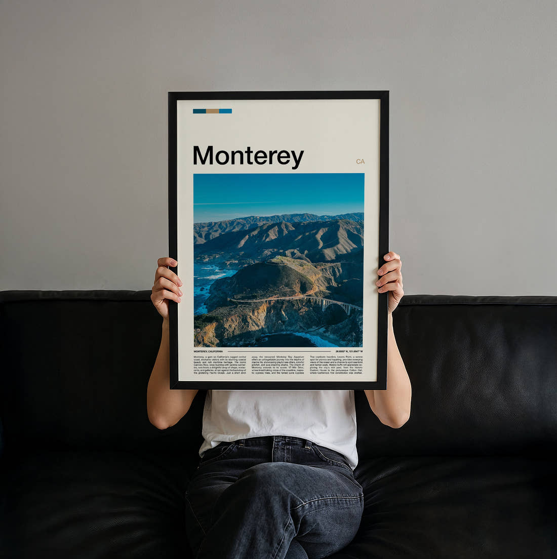 Monterey Aerial Coastal Cliffs Travel Print held up by hand to show the size of the print