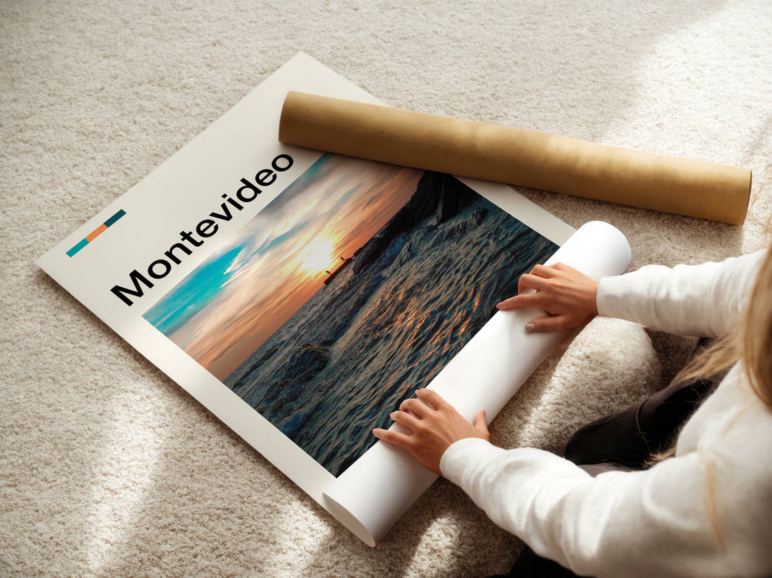 Montevideo Sunset Over Rocky Shore Travel Print being unrolled from its postal tube