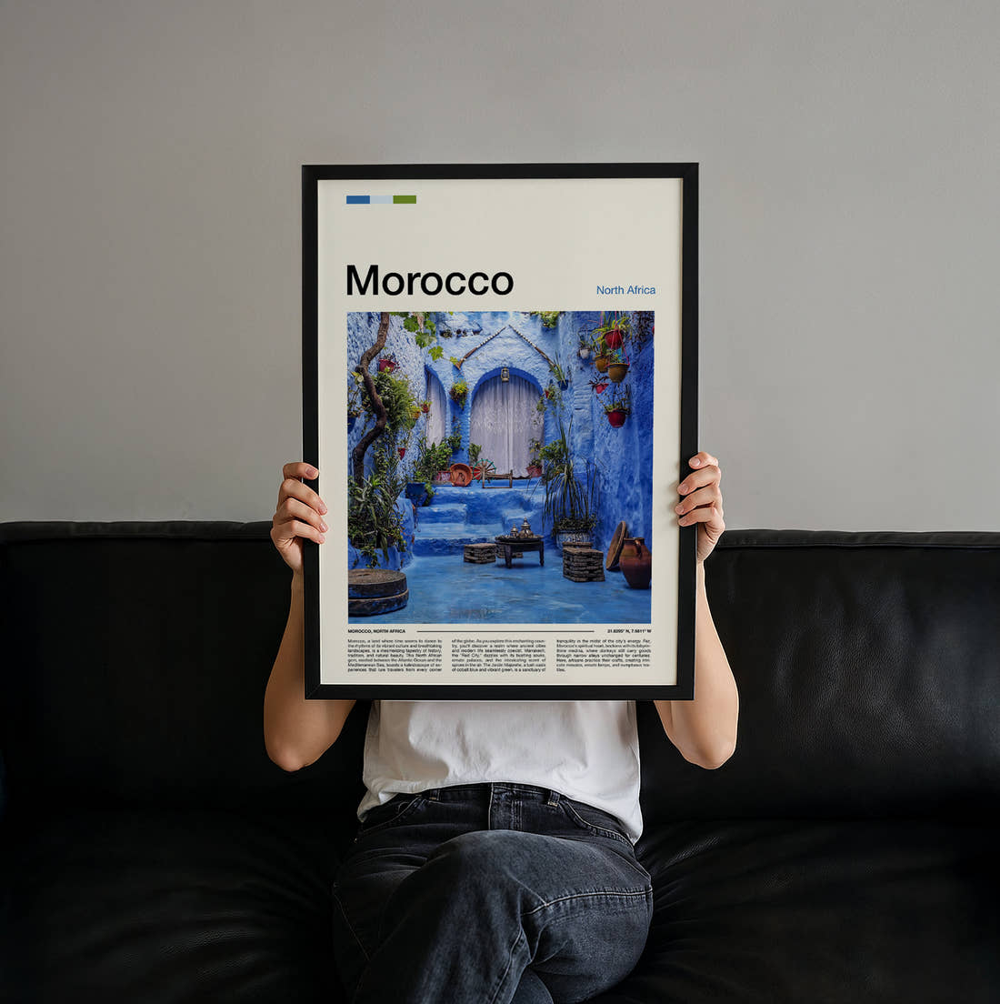 Morocco Blue Painted Courtyard Travel Print held up by hand to show the size of the print