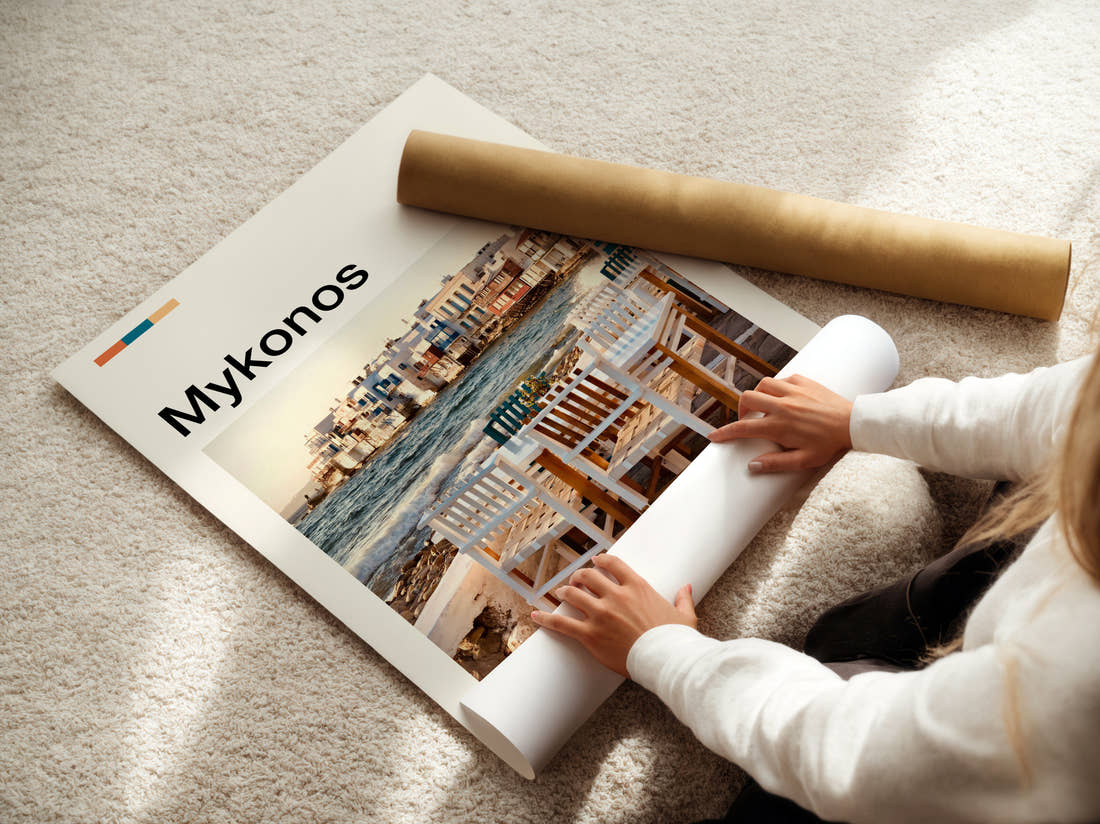 Mykonos Seaside Tables And Chairs Travel Print being unrolled from its postal tube