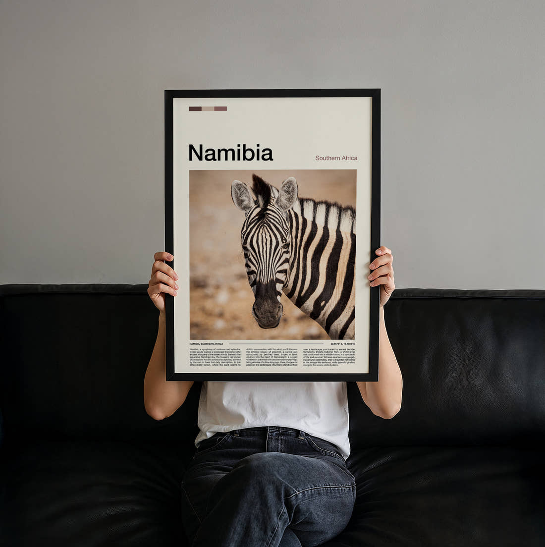 Namibia Zebra Portrait Travel Print held up by hand to show the size of the print