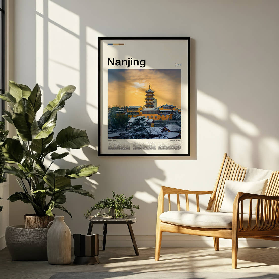 Nanjing Pagoda In Snow Travel Print framed on a pale wall beside houseplants