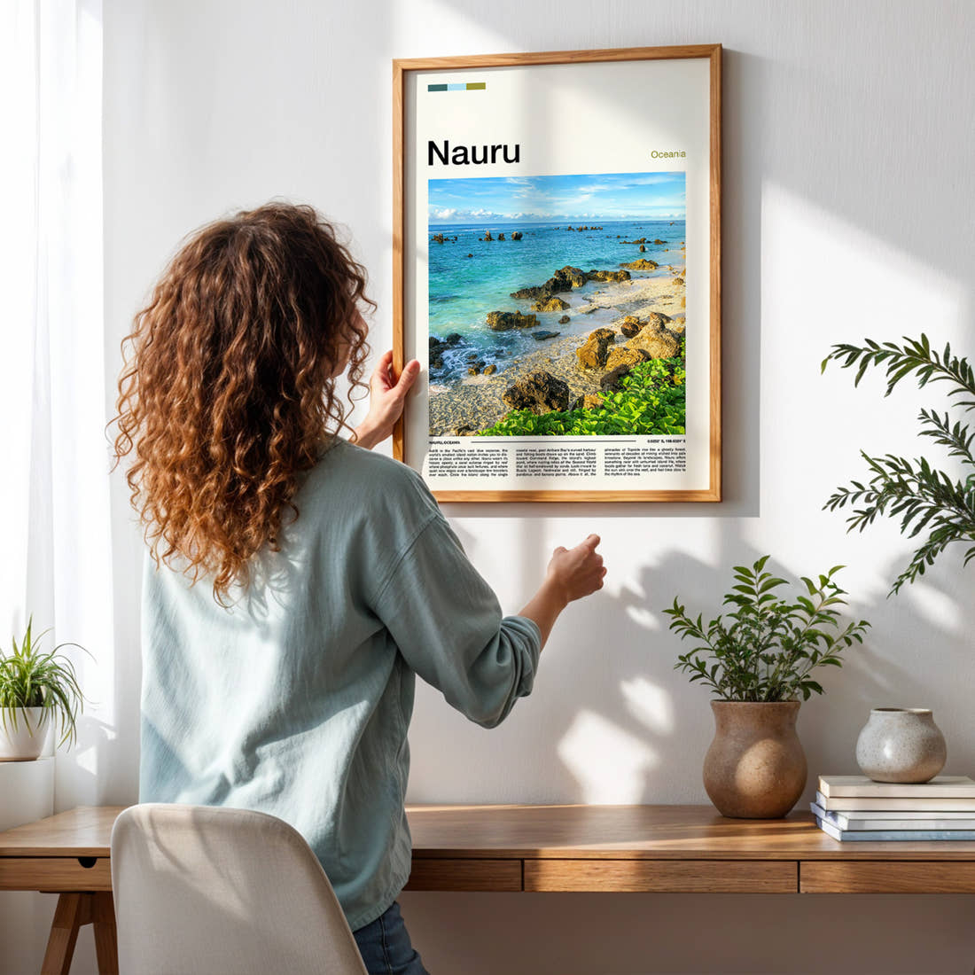Nauru Rocky Coastal Shoreline Travel Print framed on a pale wall beside houseplants