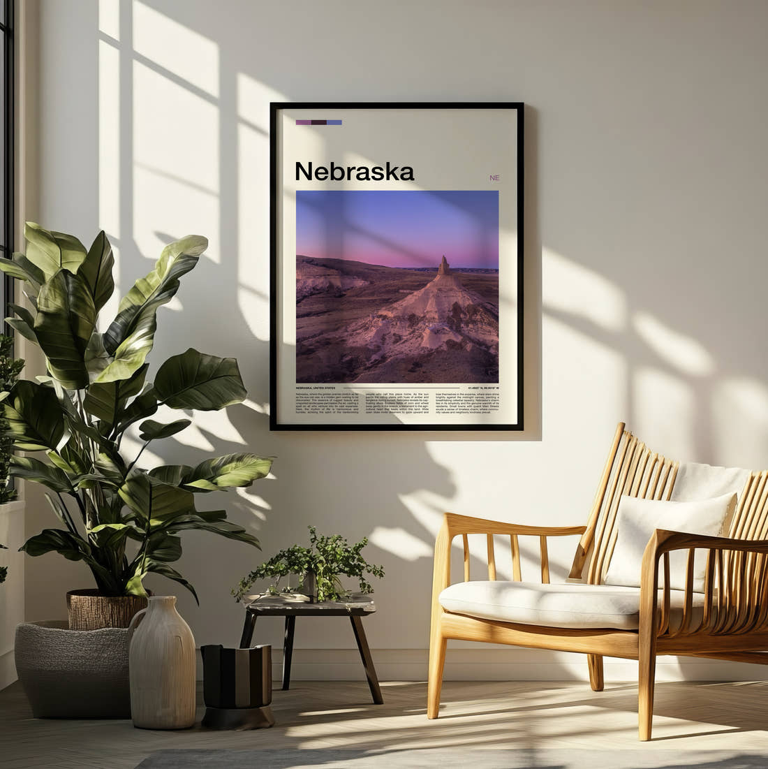Nebraska Chimney Rock Travel Print framed on a pale wall beside houseplants