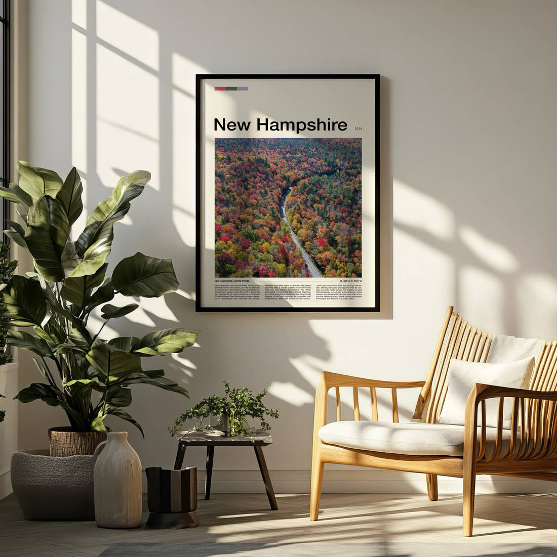 New Hampshire Road Through Autumn Forest Travel Print framed on a pale wall beside houseplants