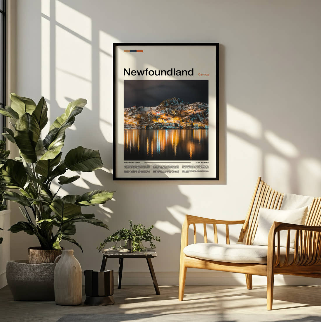 Newfoundland Harbour Town At Night Travel Print framed on a pale wall beside houseplants