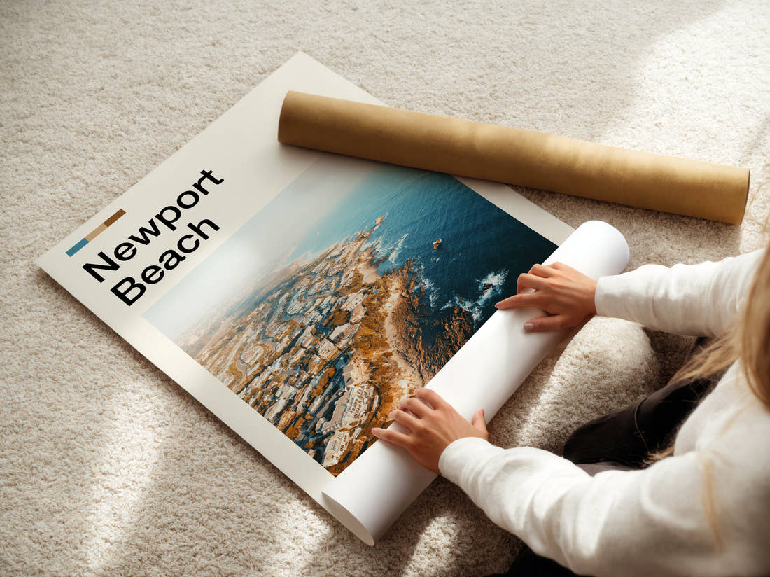 Newport Beach Rocky Coastline Aerial Travel Print being unrolled from its postal tube