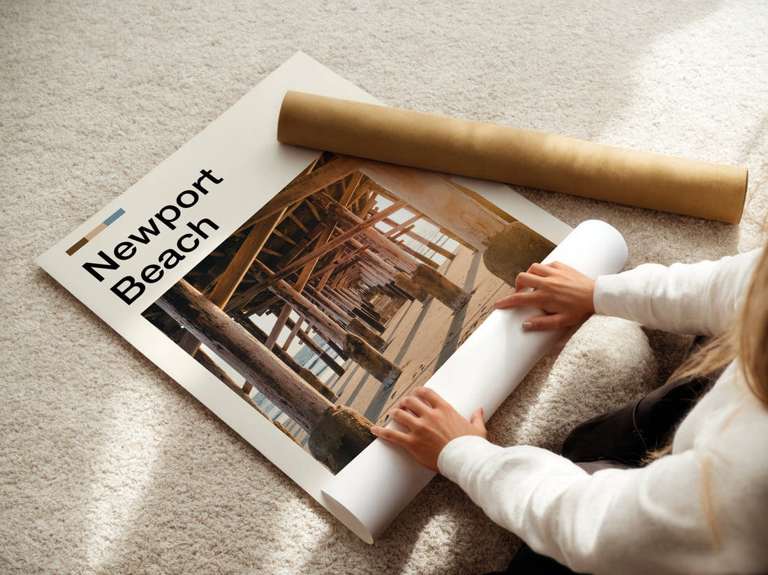Newport Beach Under The Pier Travel Print being unrolled from its postal tube