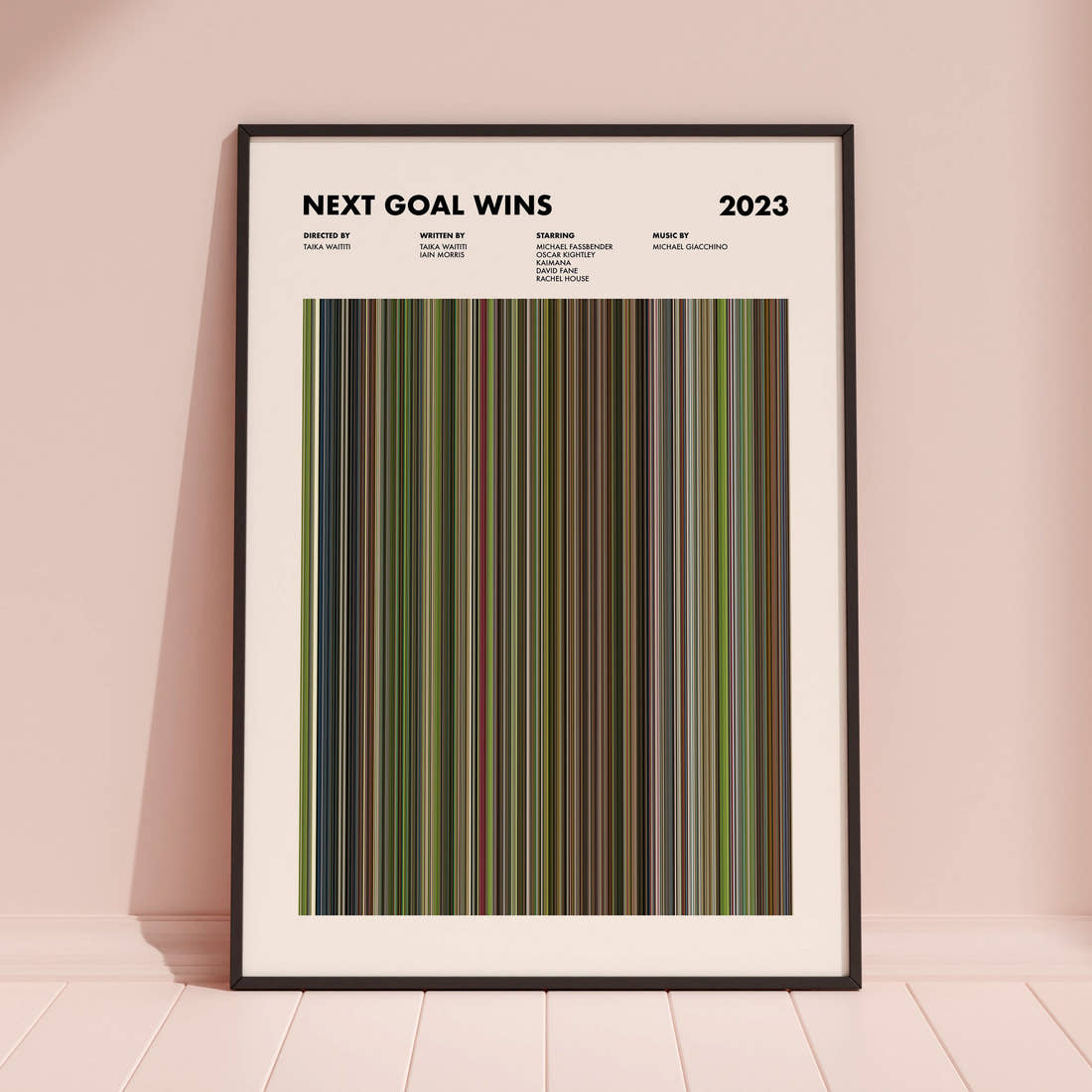 Next Goal Wins Movie Barcode Poster framed and leaning against a coloured wall
