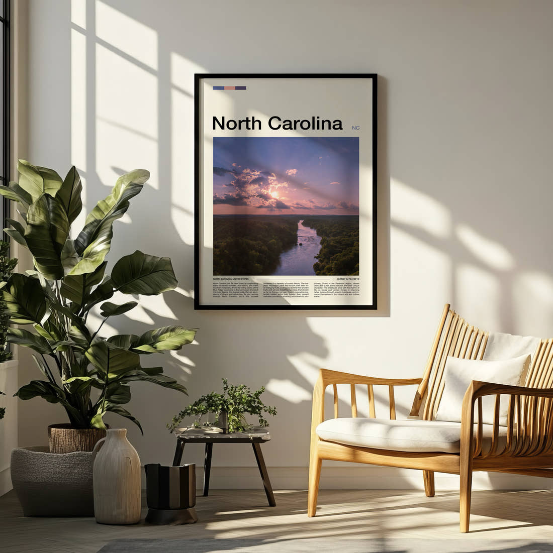 North Carolina River At Dusk Travel Print framed on a pale wall beside houseplants