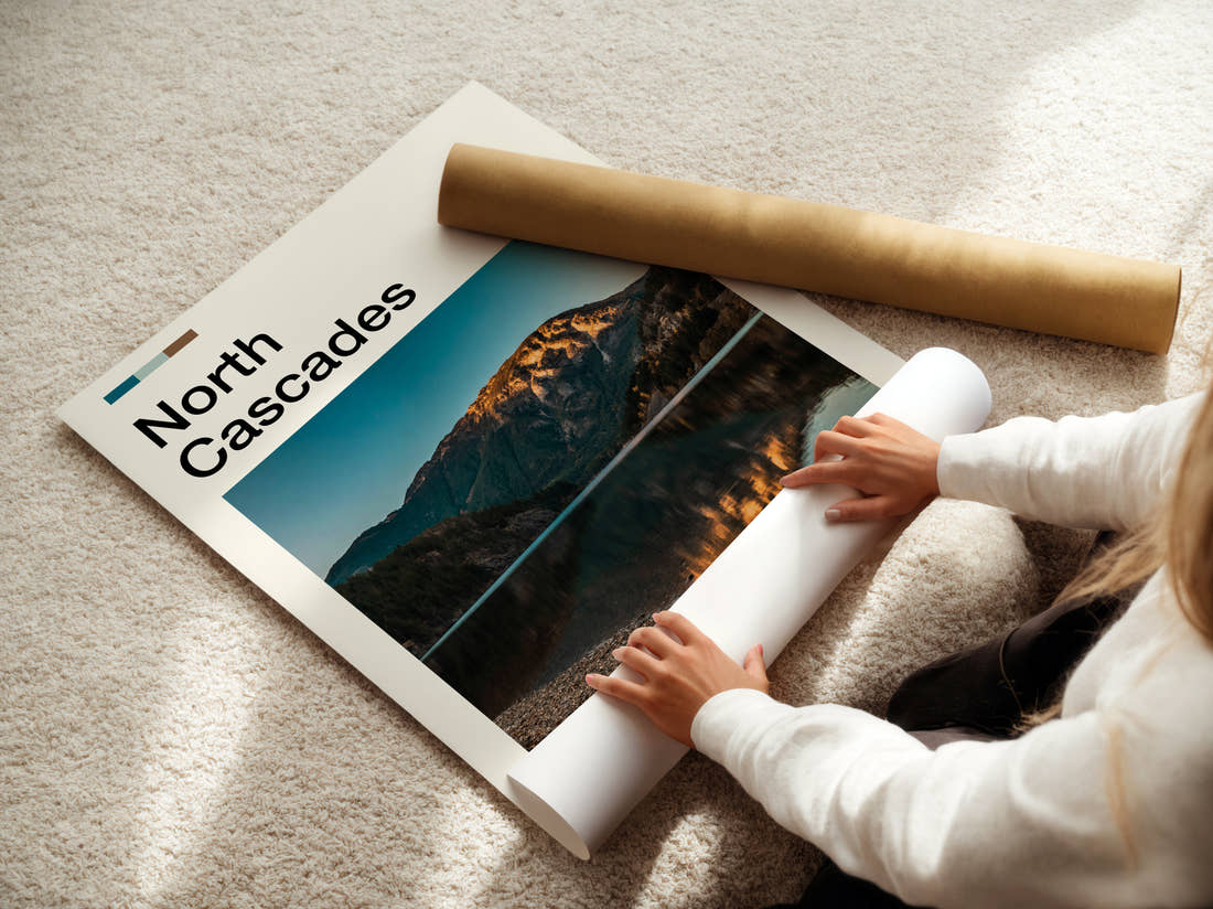 North Cascades Mountain Reflected In Lake Travel Print being unrolled from its postal tube