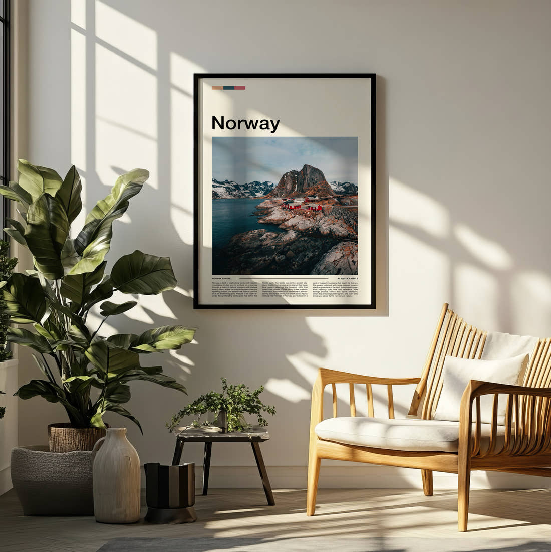 Norway Red Fishing Cabins Travel Print framed on a pale wall beside houseplants