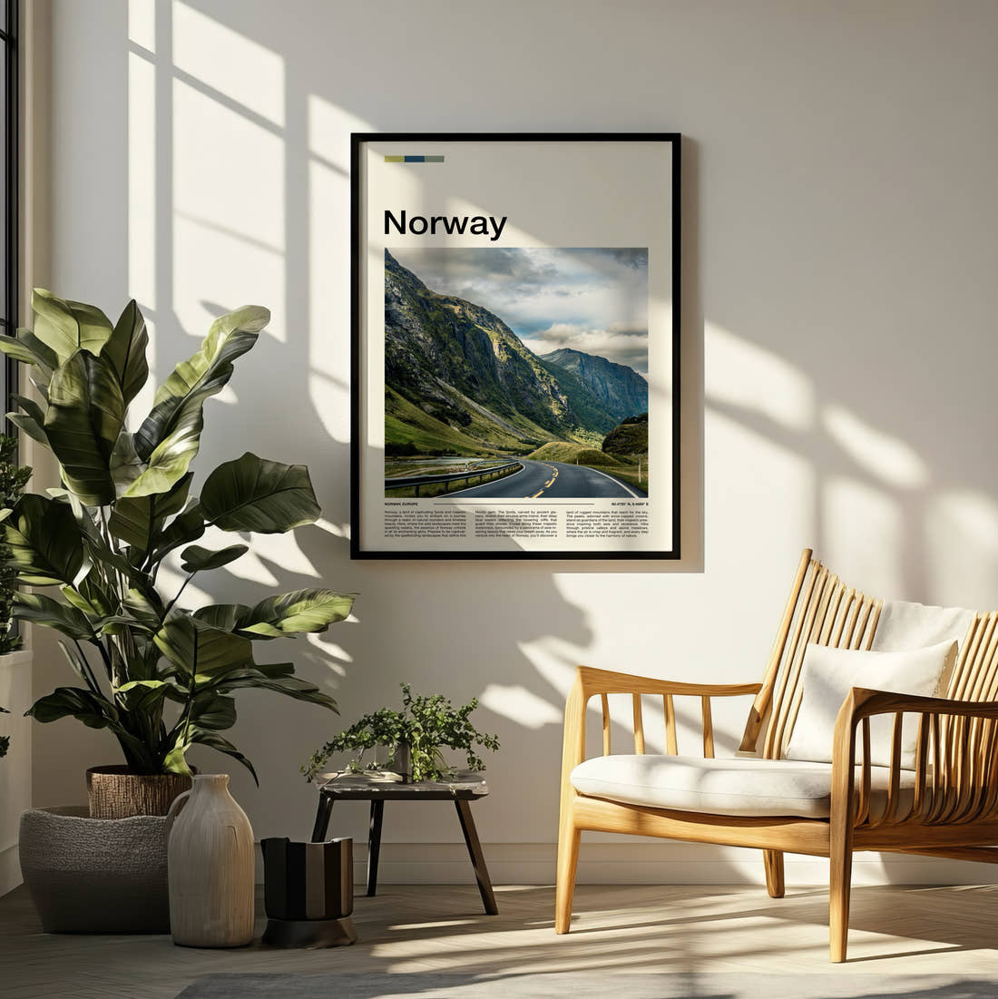 Norway Road Through Green Mountains Travel Print framed on a pale wall beside houseplants