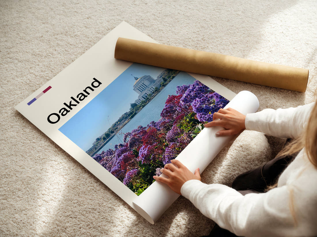 Oakland Purple Flowers By The Lake Travel Print being unrolled from its postal tube