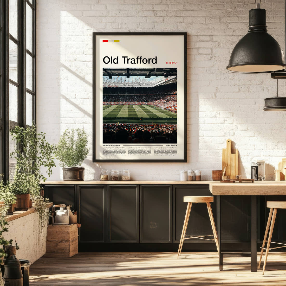 Old Trafford Stadium Print framed on the wall of a bright kitchen and dining space