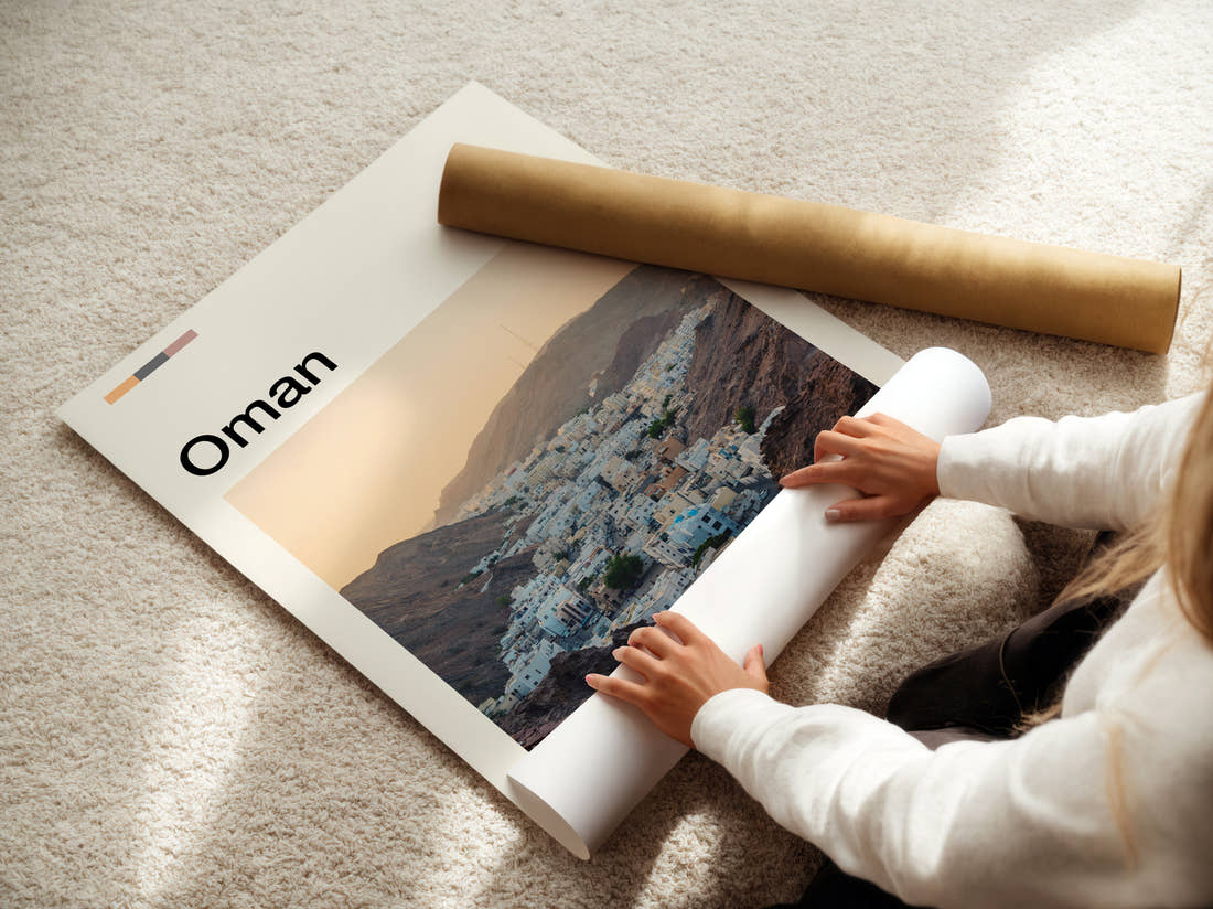 Oman Whitewashed Houses In The Valley Travel Print being unrolled from its postal tube