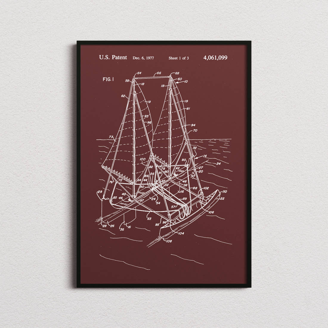 Outrigger Sailboat Patent Print in the burgundy colourway, framed