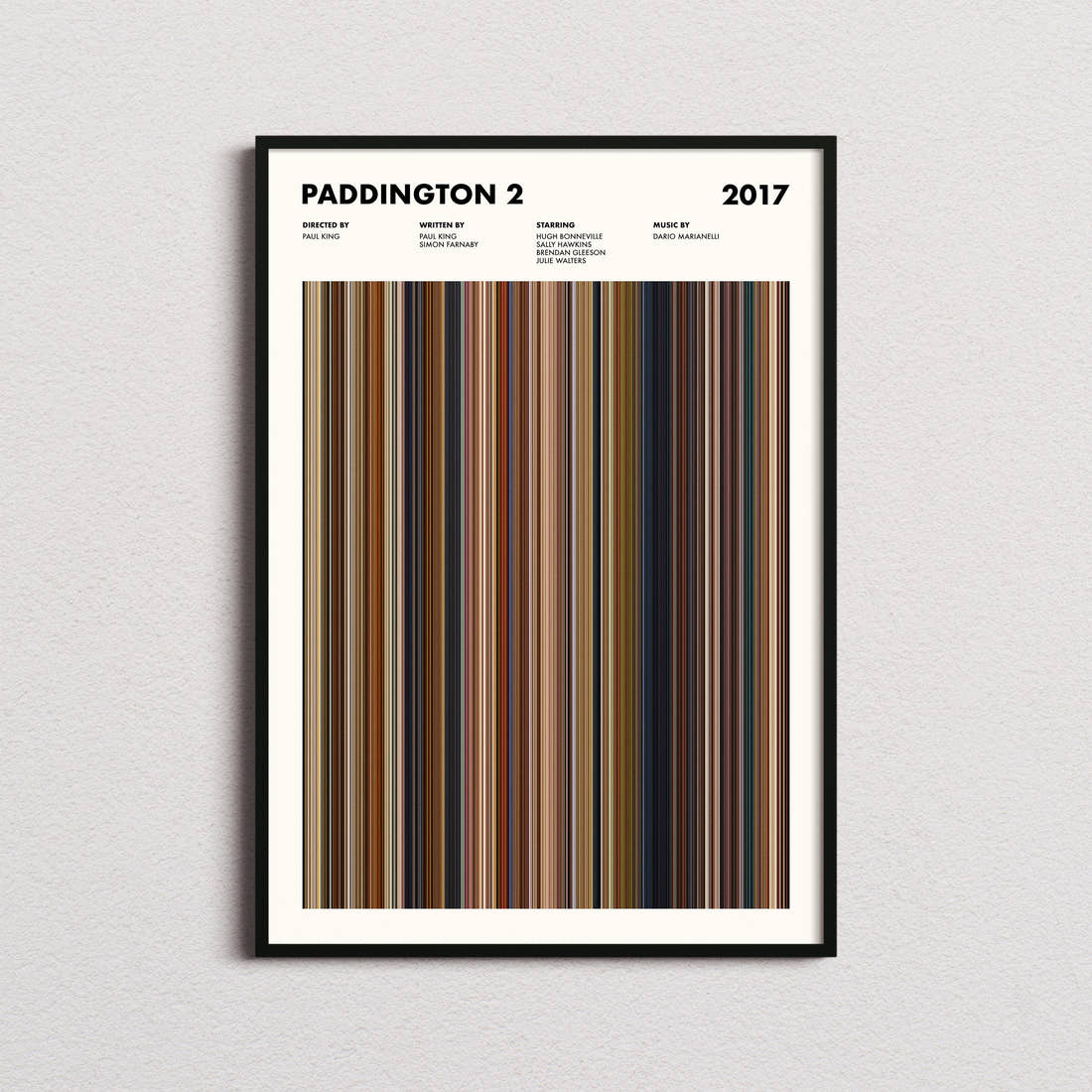Paddington 2 Movie Barcode Poster framed on a plain studio wall