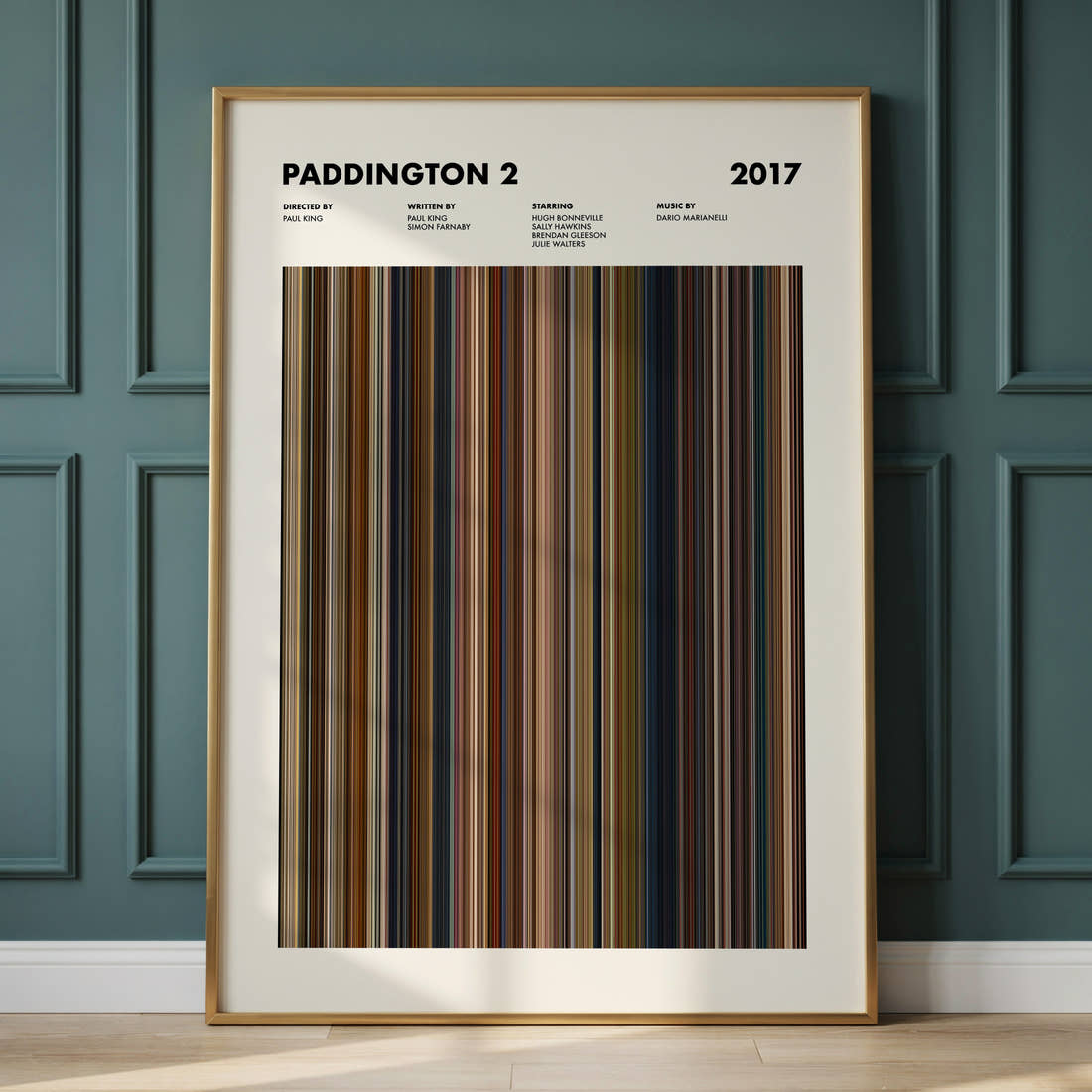 Paddington 2 Movie Barcode Poster framed and leaning against a panelled wall