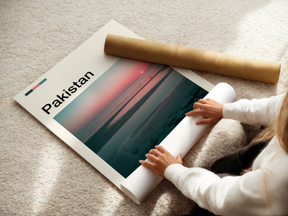 Pakistan Sunset Over The Sea Travel Print being unrolled from its postal tube