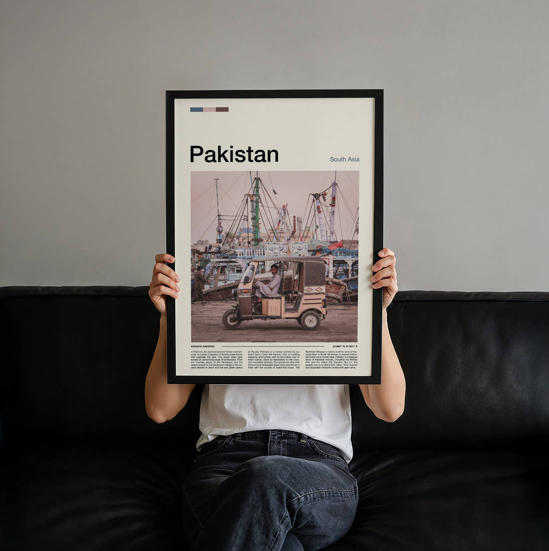 Pakistan Auto Rickshaw And Boats Travel Print held up by hand to show the size of the print