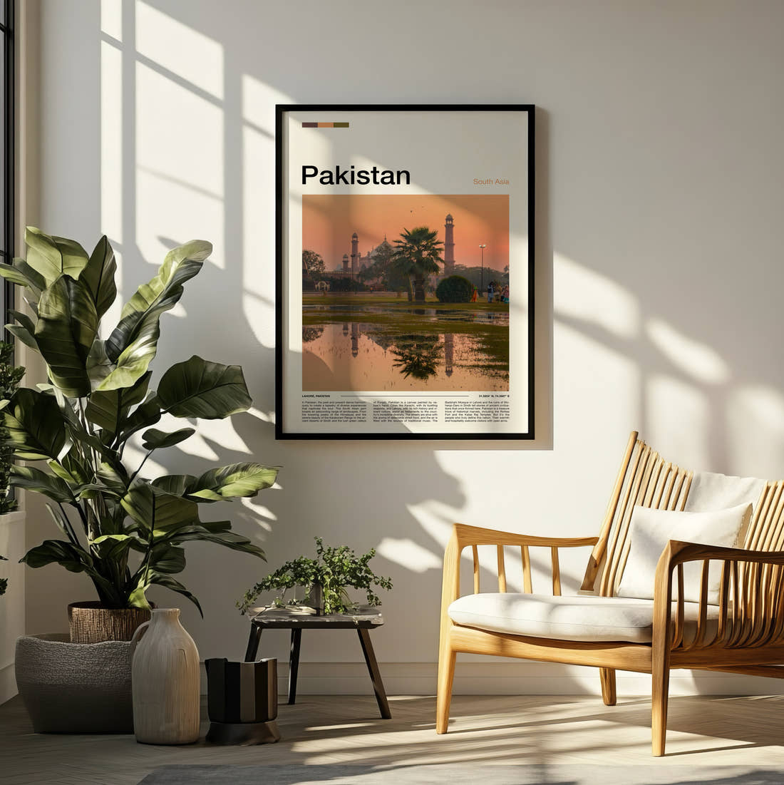 Pakistan Badshahi Mosque At Sunset Travel Print framed on a pale wall beside houseplants