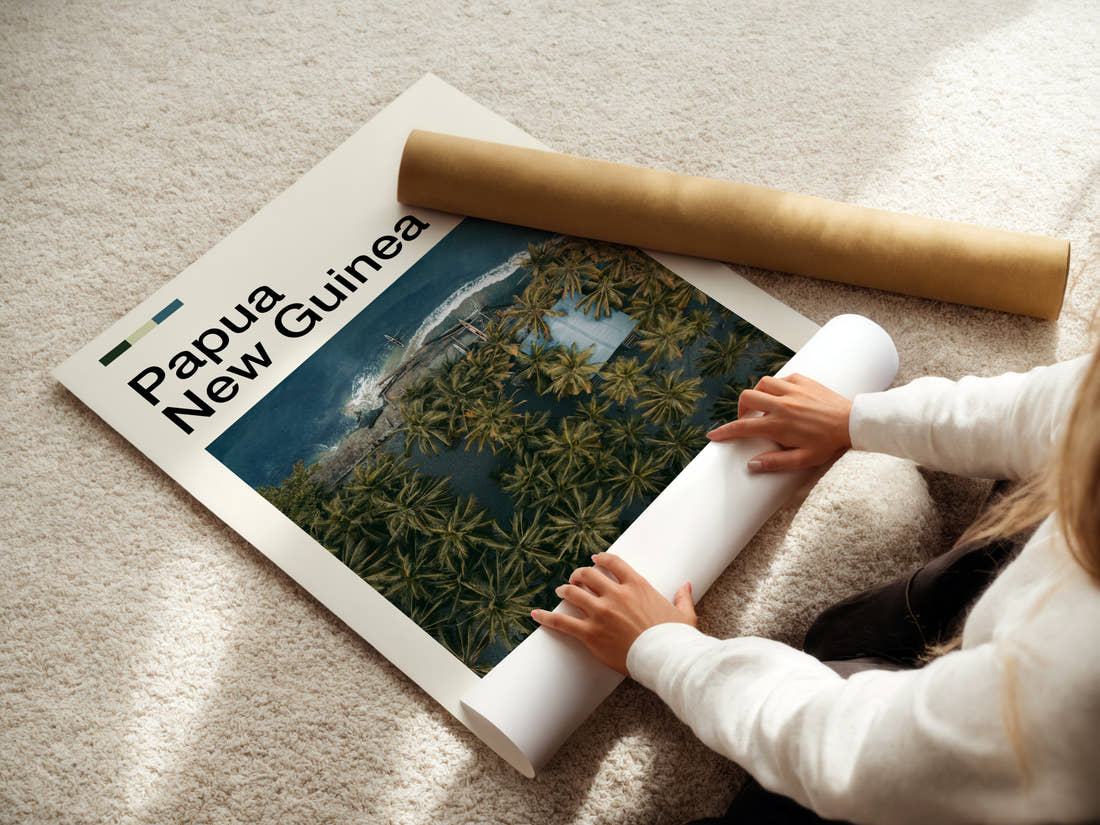 Papua New Guinea Aerial Coastal Village Travel Print being unrolled from its postal tube