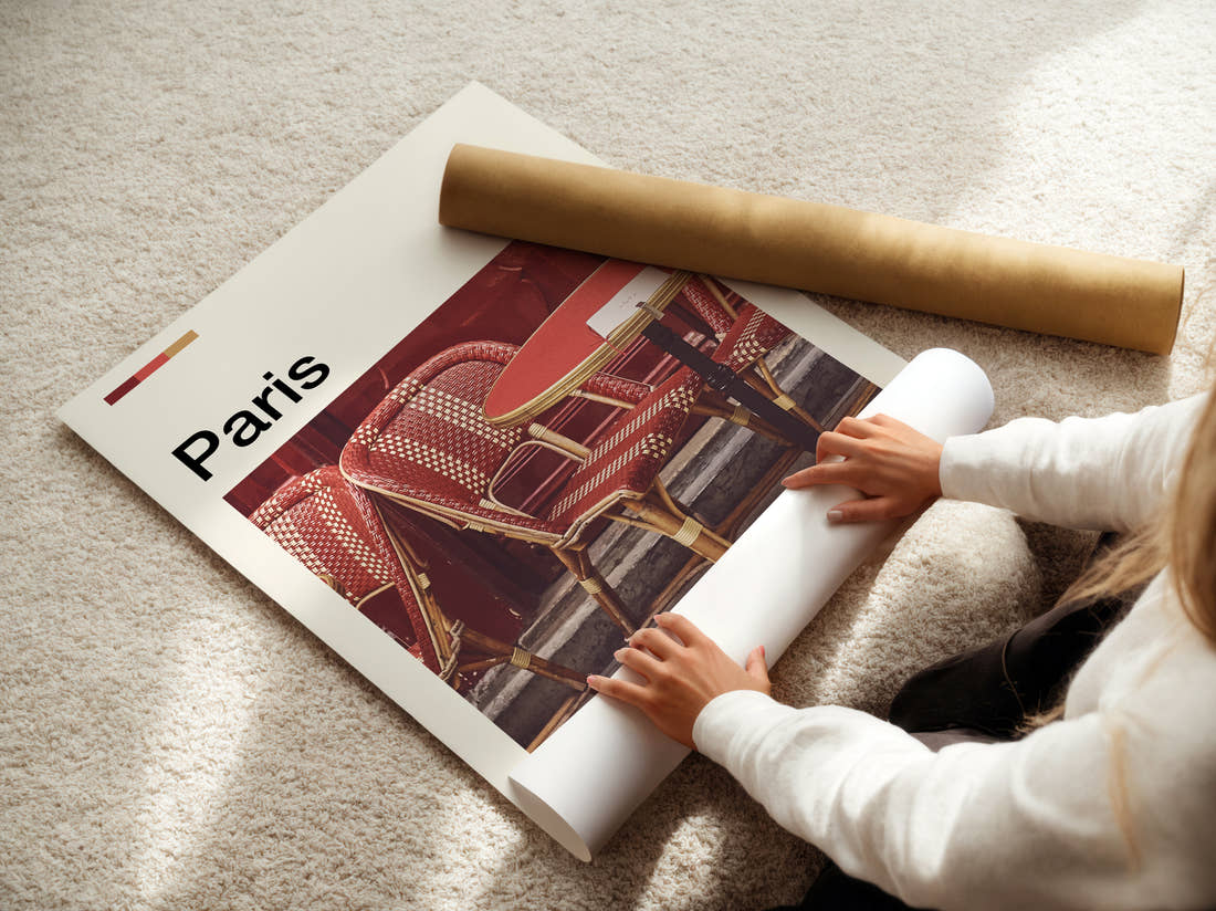Paris Bistro Chairs Travel Print being unrolled from its postal tube