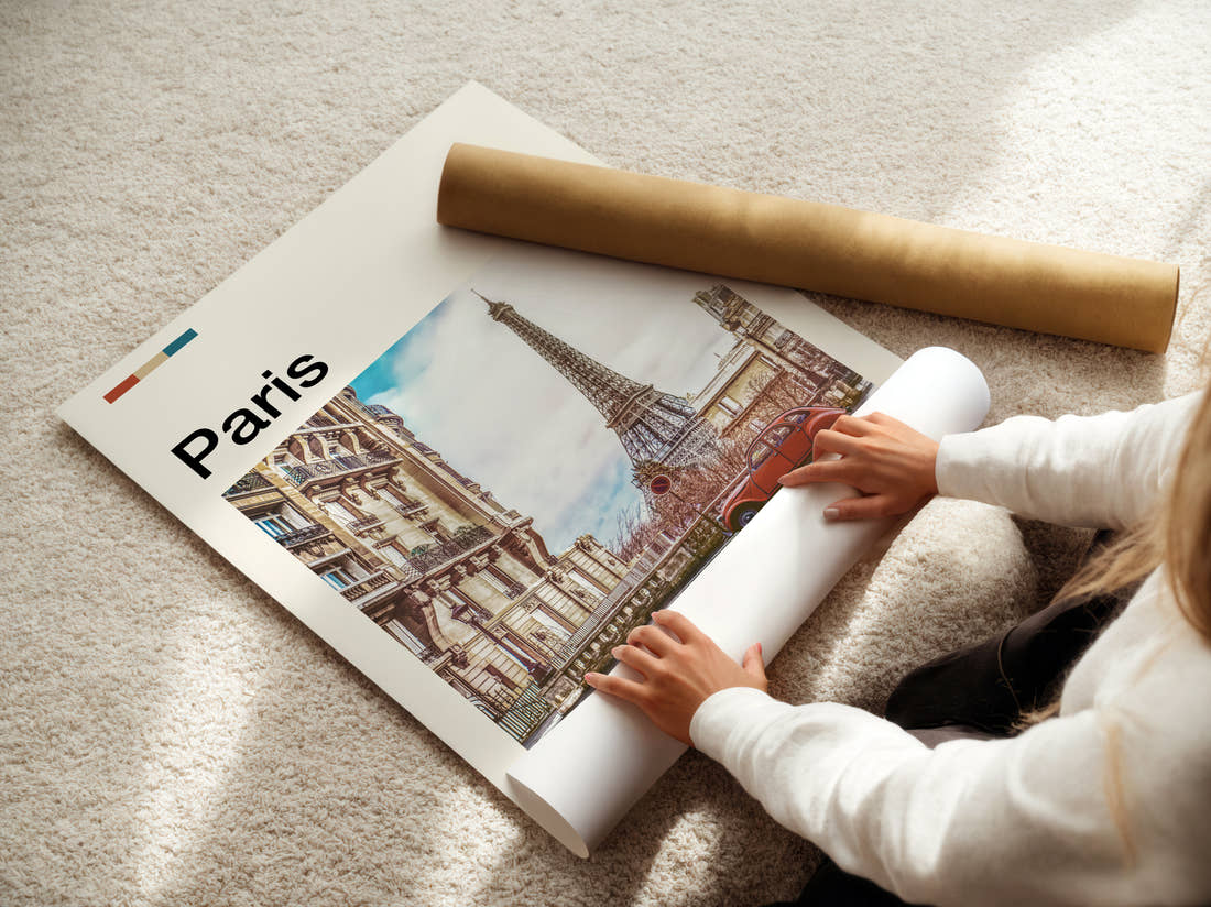 Paris Eiffel Tower And Vintage Car Travel Print being unrolled from its postal tube