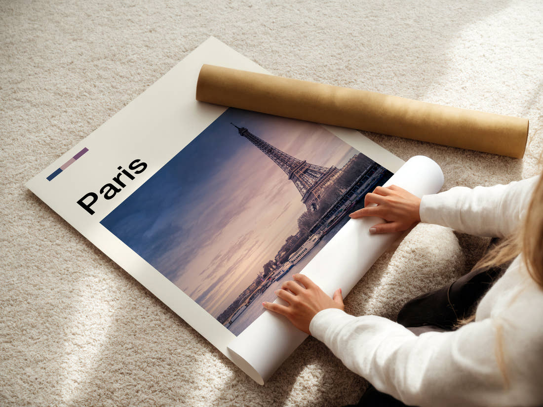 Paris Eiffel Tower Over The Seine Travel Print being unrolled from its postal tube