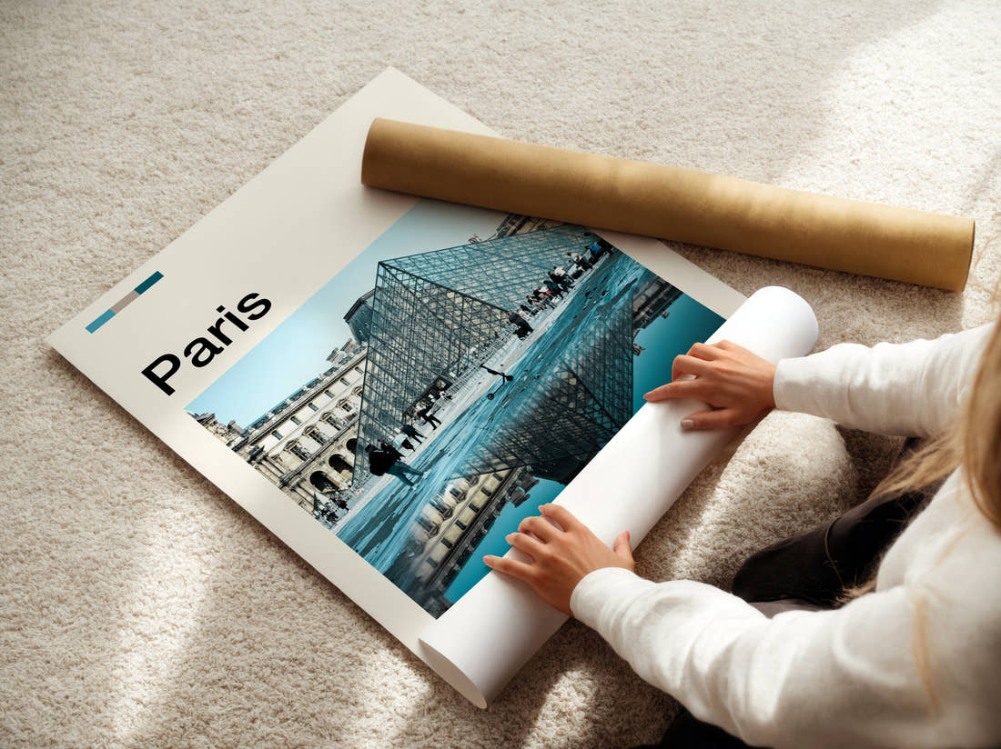 Paris Louvre Pyramid Travel Print being unrolled from its postal tube