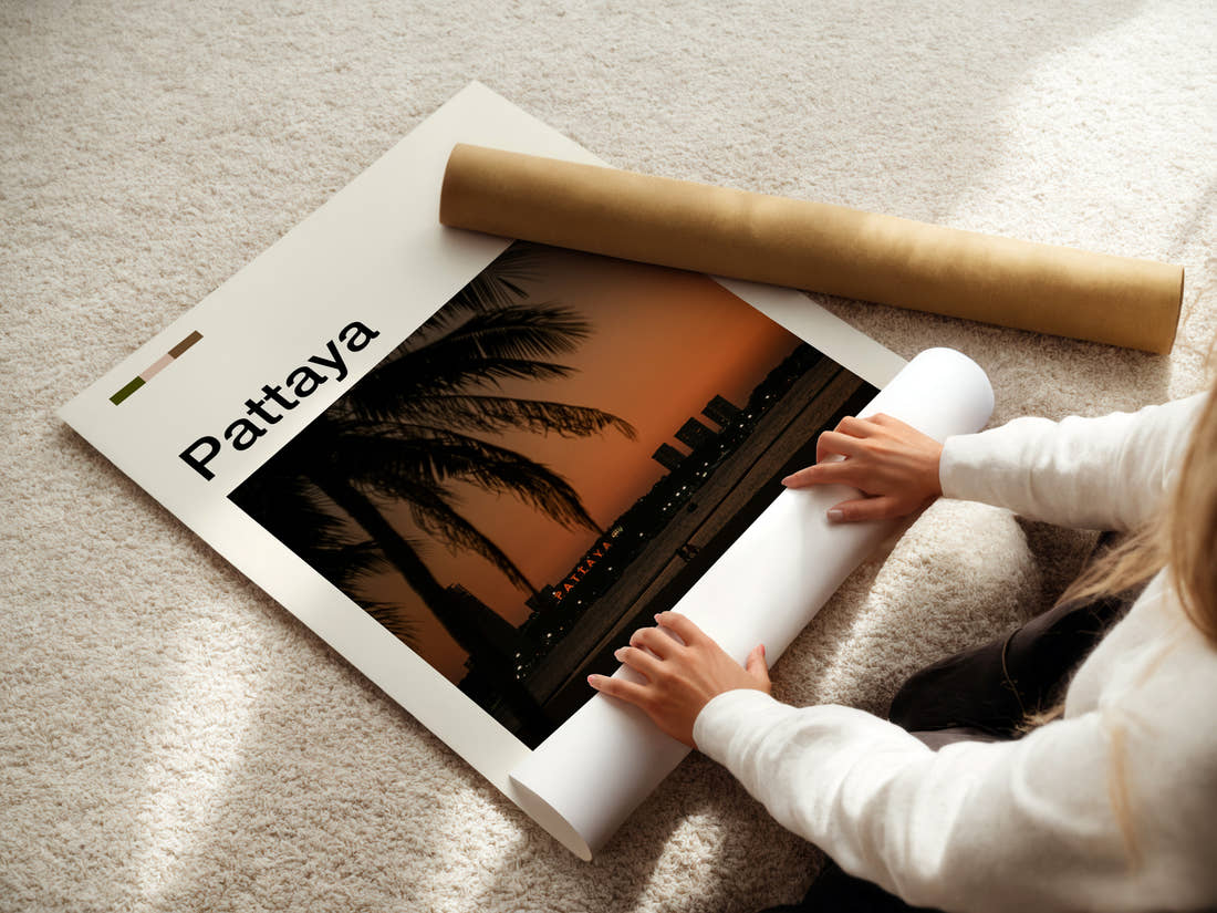 Pattaya Palm-Framed Sunset Skyline Travel Print being unrolled from its postal tube