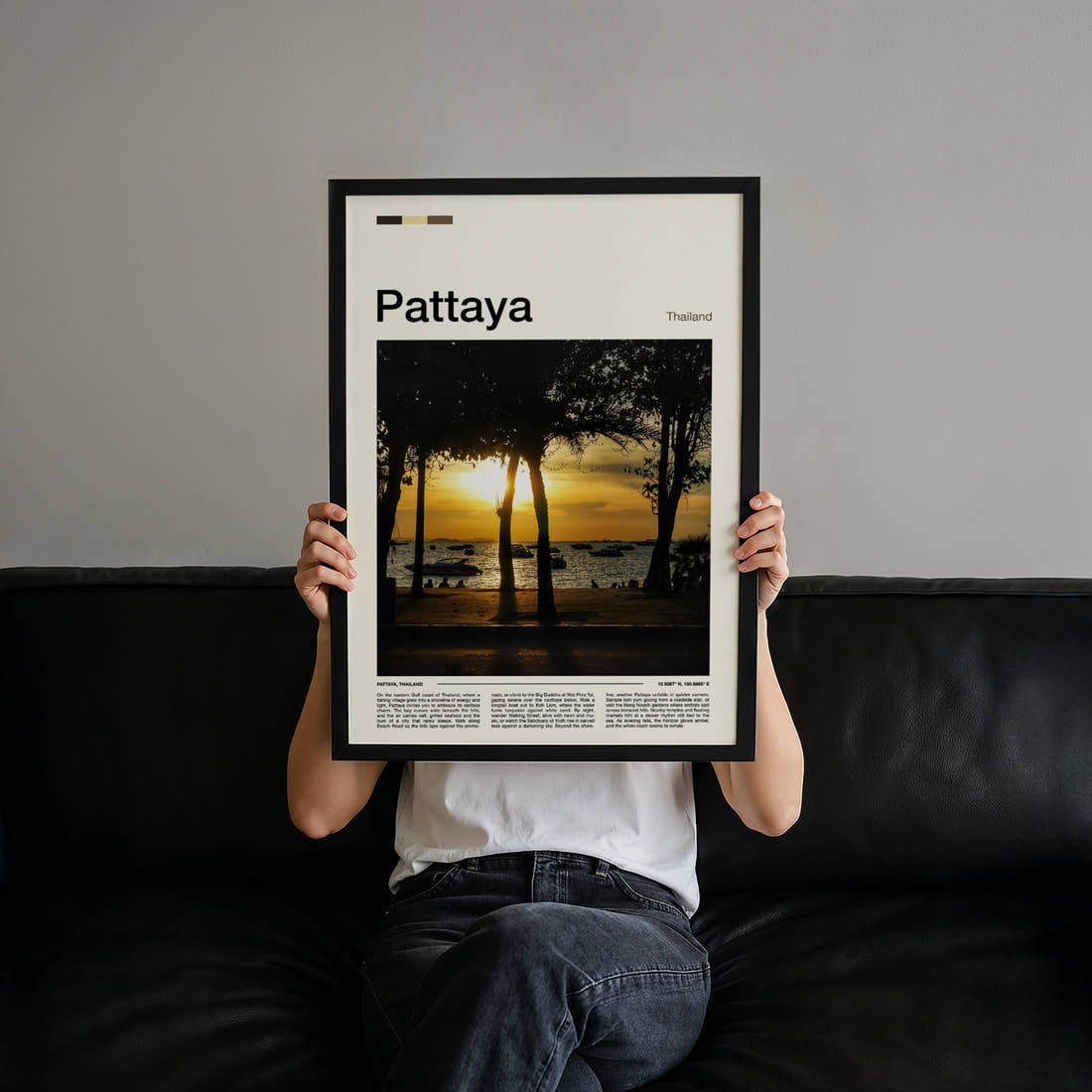 Pattaya Palm-Framed Sunset Travel Print held up by hand to show the size of the print