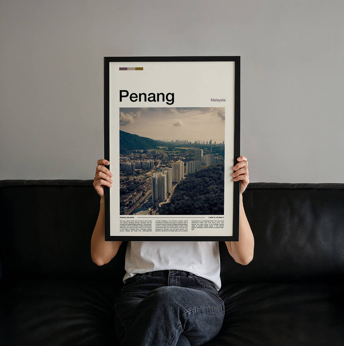 Penang Aerial View Of City Travel Print held up by hand to show the size of the print