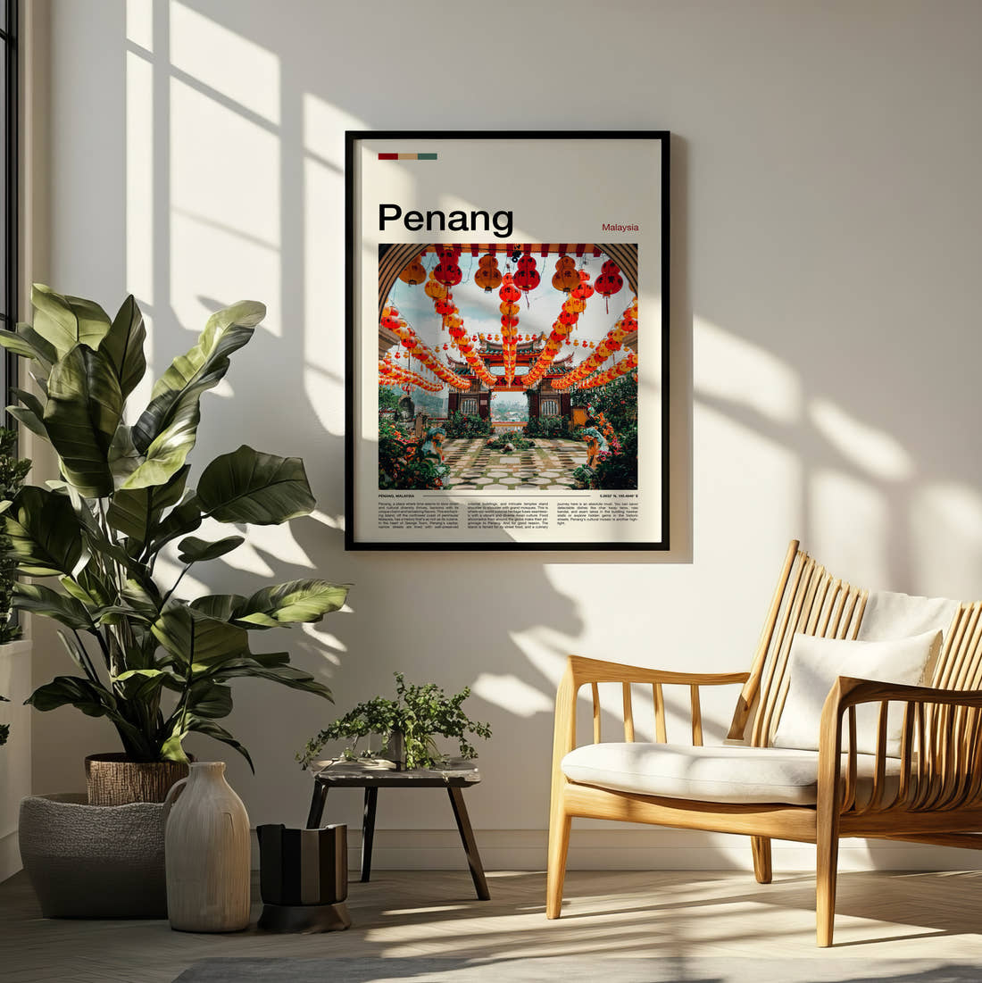 Penang Red Lanterns Travel Print framed on a pale wall beside houseplants