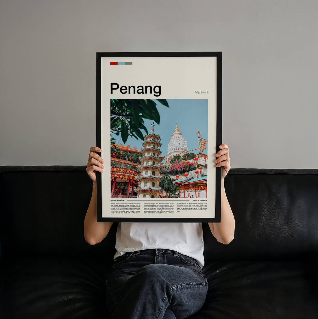 Penang Pagoda And Temple Travel Print held up by hand to show the size of the print