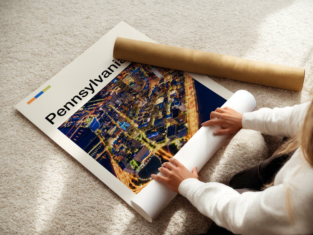 Pennsylvania Night Skyline From Above Travel Print being unrolled from its postal tube