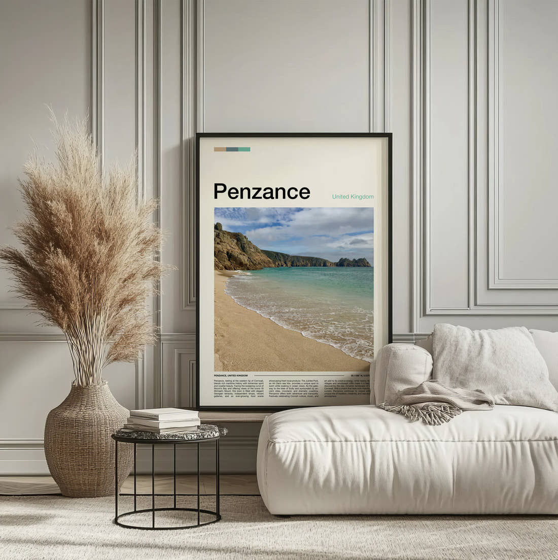 Penzance Beach And Cliffs Travel Print framed on the wall of a calm, neutral bedroom