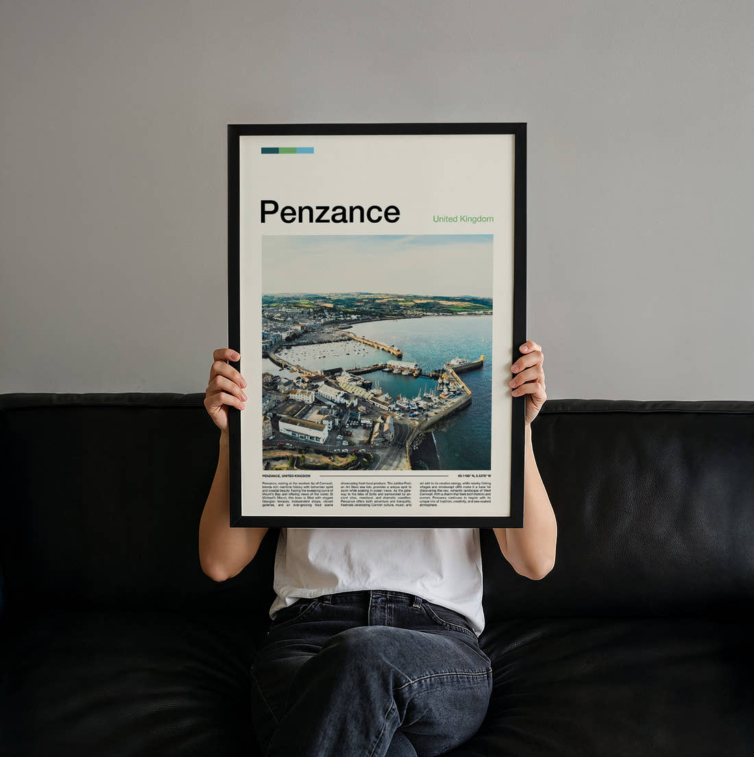 Penzance Harbour From Above Travel Print held up by hand to show the size of the print