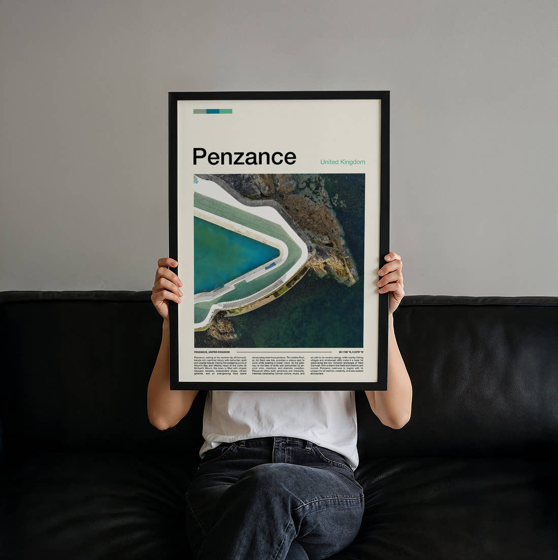 Penzance Jubilee Pool Travel Print held up by hand to show the size of the print