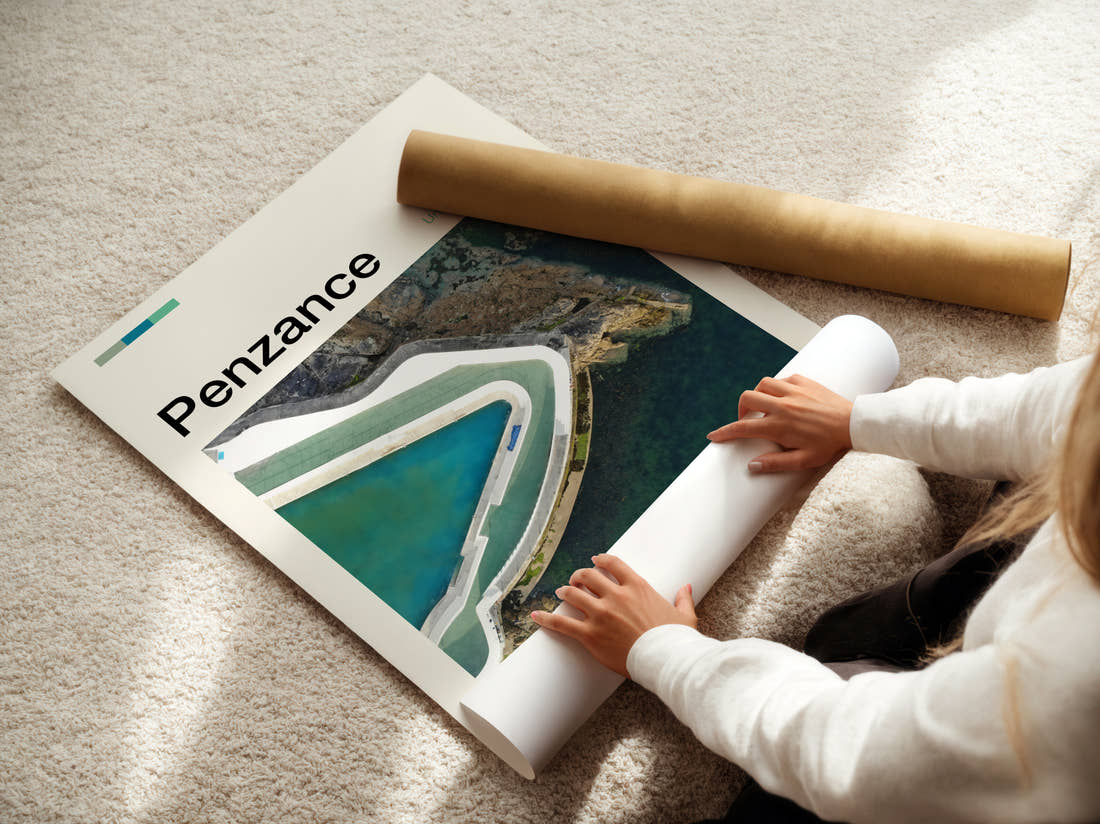 Penzance Jubilee Pool Travel Print being unrolled from its postal tube